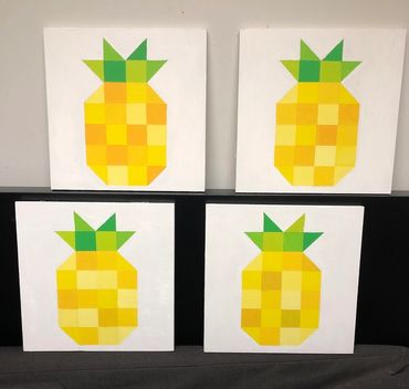 Four pixelated pineapple paintings arranged in a grid.