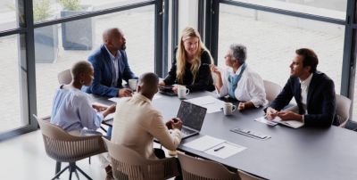 Business team meeting around a conference table.
