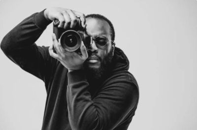 Man taking a photo with a camera.