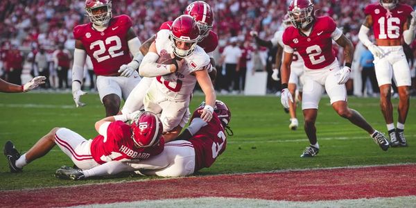 QB John Mateer scores on a twisting keeper against Alabama.