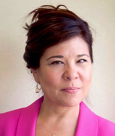Black and white portrait of a woman with an elegant updo hairstyle.
