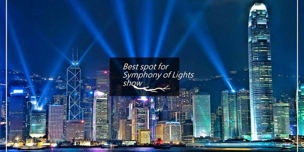 City skyline illuminated for Symphony of Lights show at night.