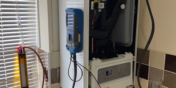 Heating system with diagnostic tools connected in a utility room.