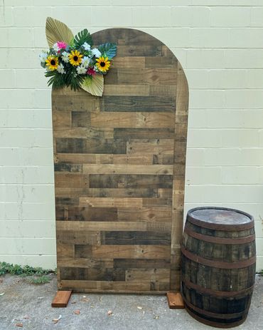 Rustic shiplap wood look design backdrop with accent wine barrel