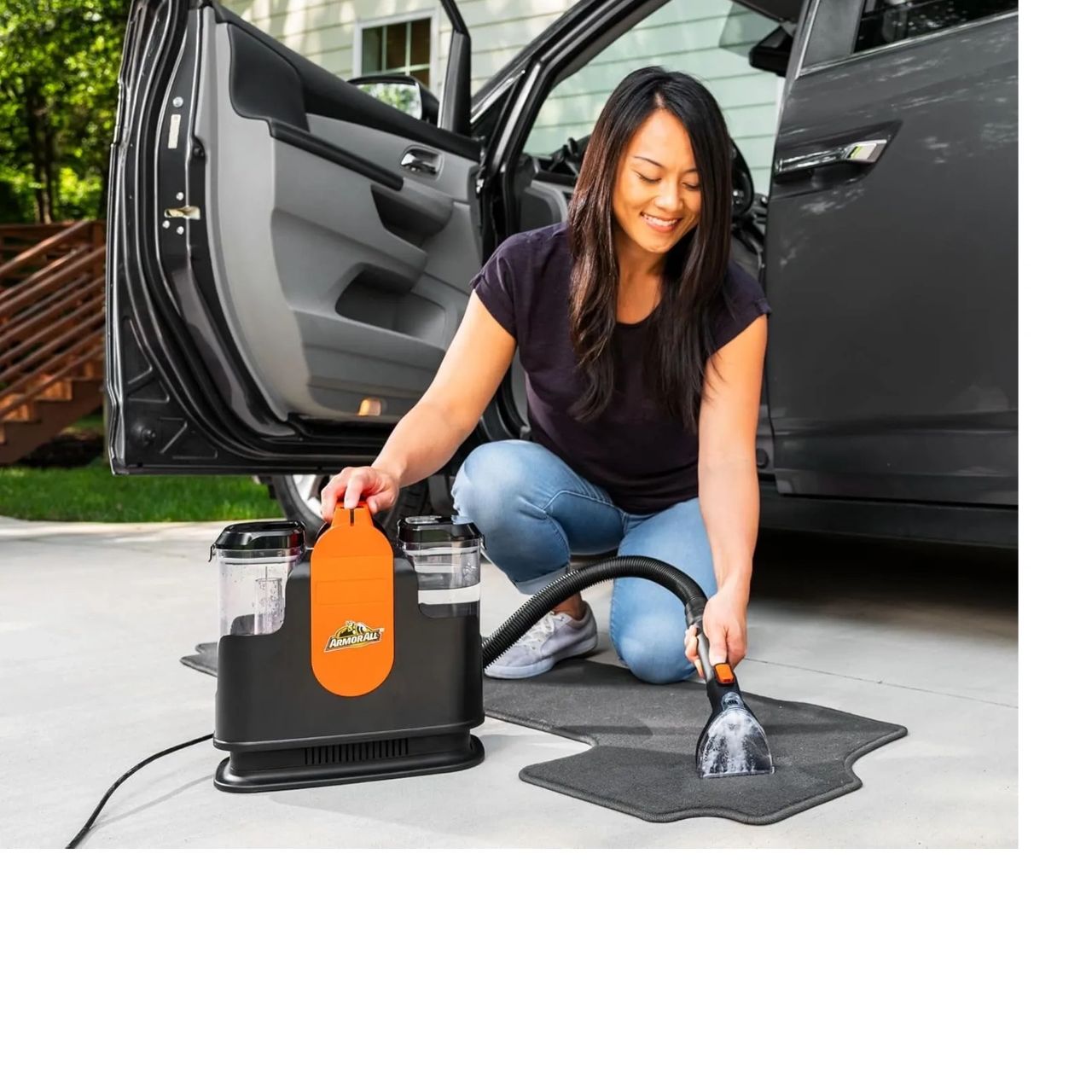 A women Vacuuming her car mats