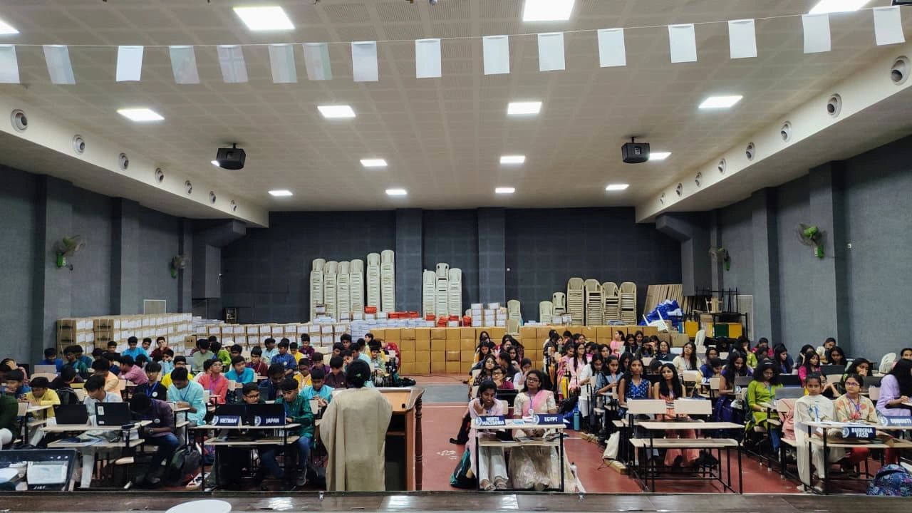 Students seated in a large hall for a Model United Nations event.