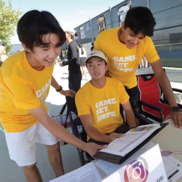 Ethan, Kaden, and Arav welcoming players at the 2023 Tennis Charity Tournament.