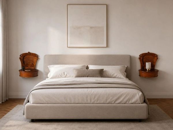Minimalist bedroom with beige tones and vintage wooden wall shelves.