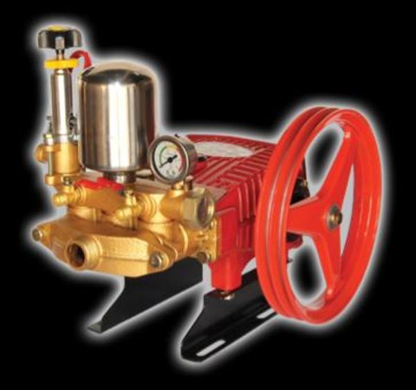 Red and gold mechanical pump with pressure gauge.