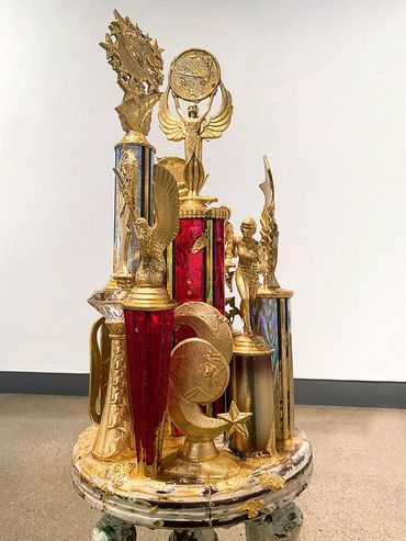 I’ll Be Working, Trophies, Gold Leaf, Resin, Paint, Antique Heirloom Stool, 36” x 15” x 15”, 2022