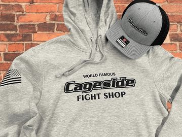 Custom printed hoodie and embroidered trucker hat showcasing branded apparel by Durham Shirts