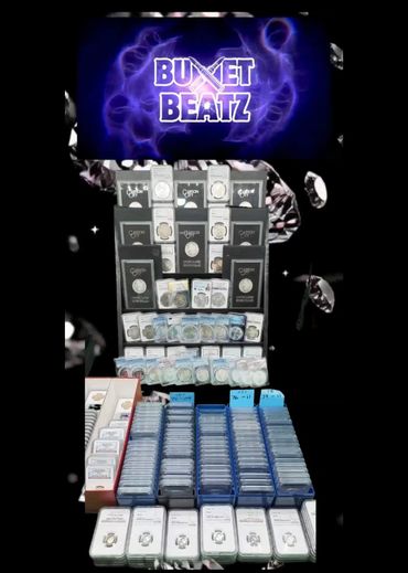 A large collection of graded coins displayed under a Bucket Beatz sign.