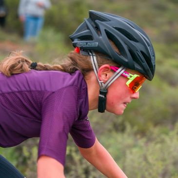 Side profile wearing Salice performance sunglasses while cycling.