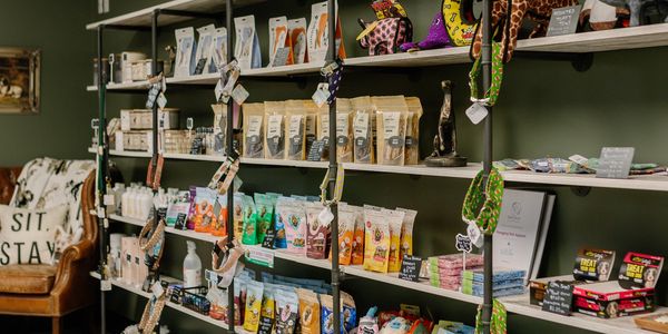 Shelves filled with various pet supplies and treats.