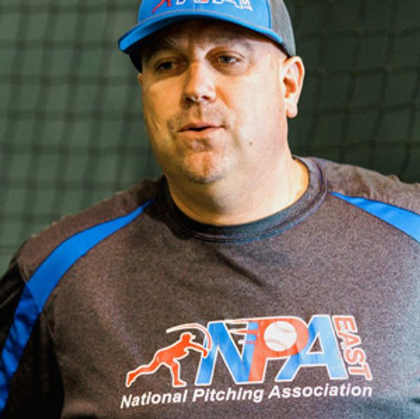 Man wearing NPA East sweatshirt and cap