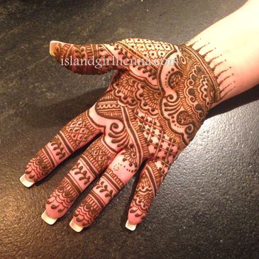 Indian bridal mehndi henna design on hand. What is henna. How to care for a henna tattoo.