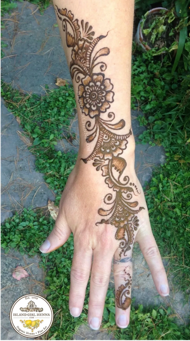 Arabic henna design on arm and hand