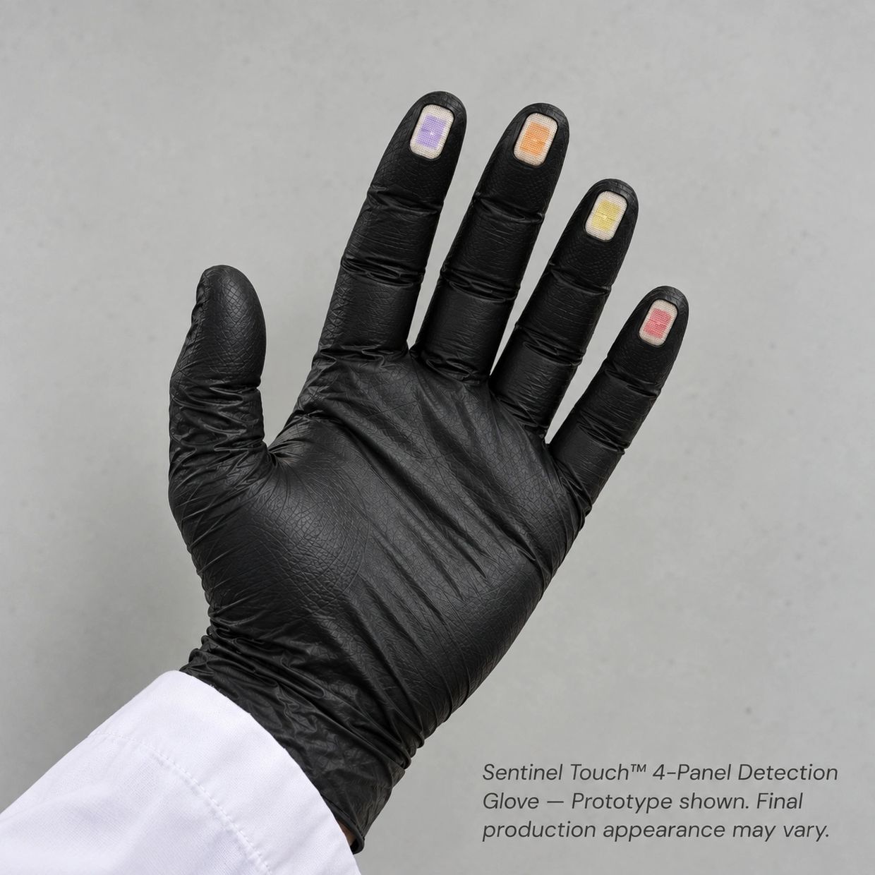 Black glove with colored sensor panels on fingertips.