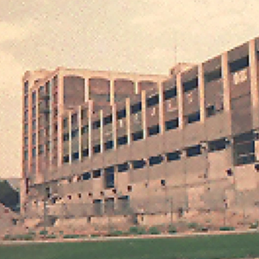 Abandoned building under a highway overpass.