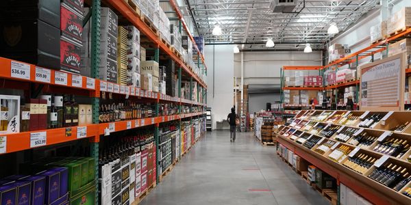 Interior view looking down the liquor section including fine wine section.