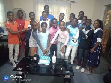 Children cutting the cake. 