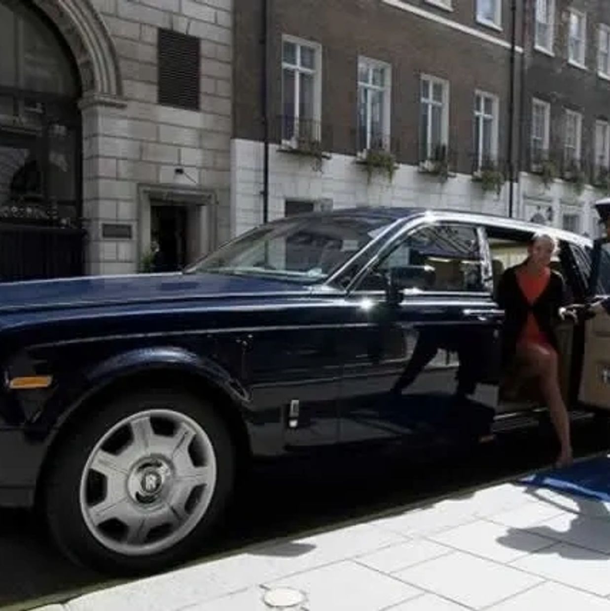 A serene landscape featuring rolling hills, a clear blue sky, and a tranquil river flowing through the valley.