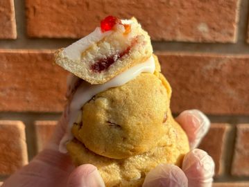 Cherry Bakewell stuffed cookie with almonds & cherry jam.