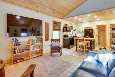 Warm, inviting cabin kitchen with wood ceiling and a sturdy butcher b