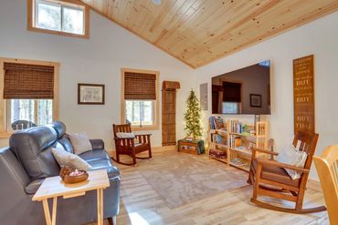 Cabin kitchen with exposed wood ceiling beams