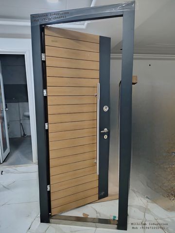 Modern wooden door with black frame in a sleek interior setting.