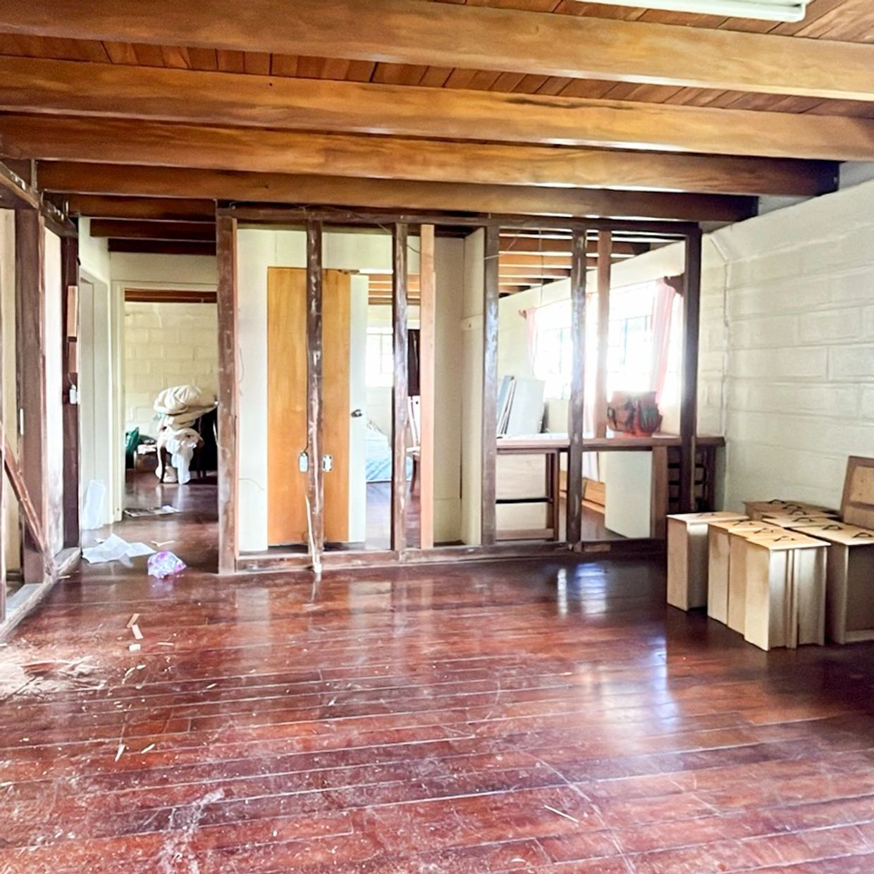 Room under renovation with exposed wooden framing.