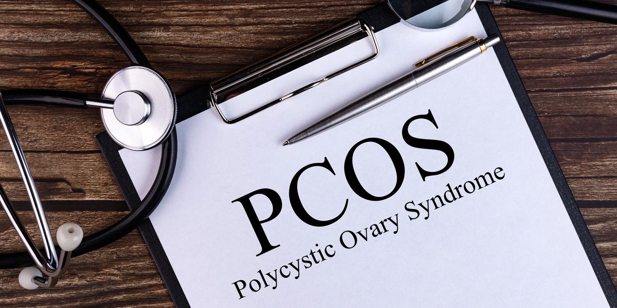 clip board with PCOS printed on paper 