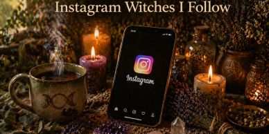 Smartphone with Instagram surrounded by candles and witchcraft items.