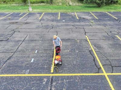Parking lot line stripe painting in Portage, Michigan.