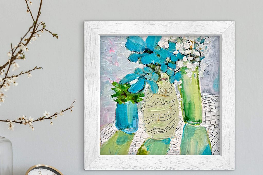 Abstract painting of blue and white flowers in vases with a white frame.