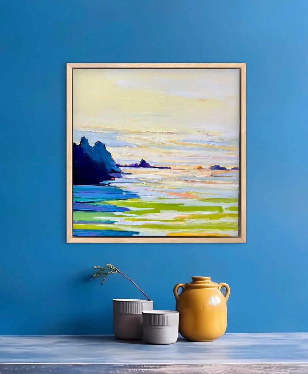 Abstract seascape painting with vibrant blues and greens on a blue wall.