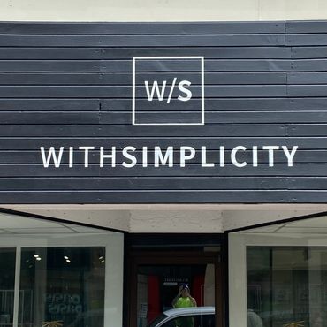 Large wall painting of logo for WithSimplicity.