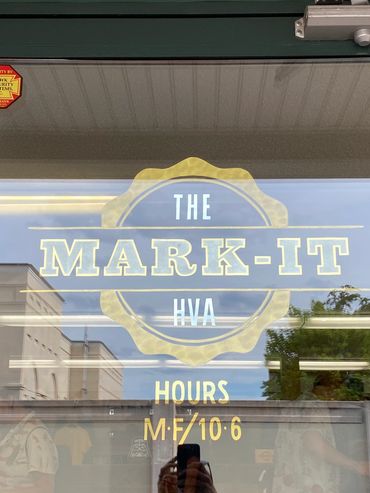Glass gilding with gold leaf of a logo for The Mark-It.