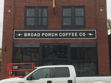 Large wall painting of logo for Broad Porch Coffee Co.