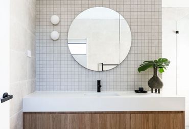 Bathroom renovation with matte black basin mixer.