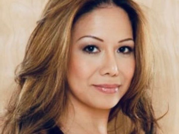 Portrait of a woman with long hair and subtle makeup.