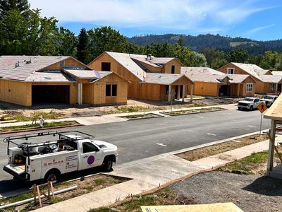 Newly constructed houses in a suburban neighborhood during daytime.