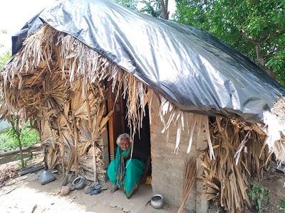 Woman sitting inside hut