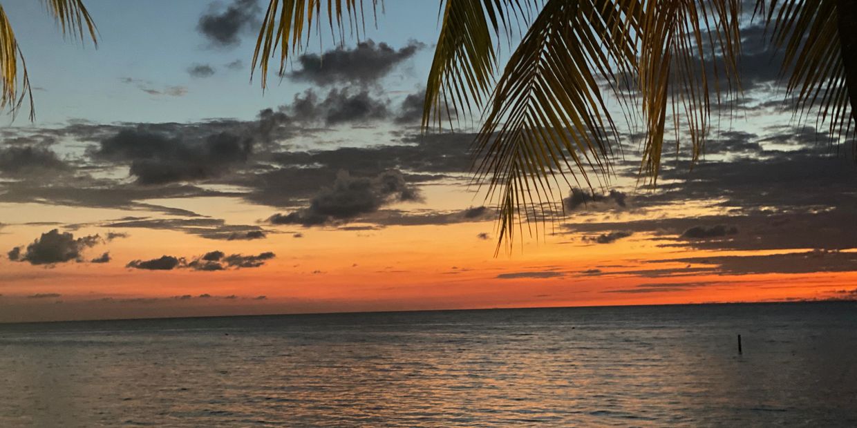 Colorful sunset over West Bay Beach in Roatan