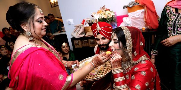 Traditional Indian wedding ceremony with bride and groom in vibrant attire.