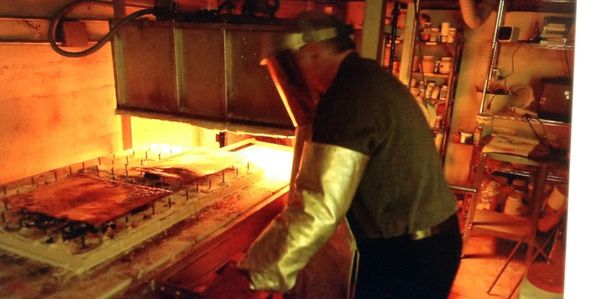 This is a photo of me melting glass on metal at very high temperatures in an electric oven.