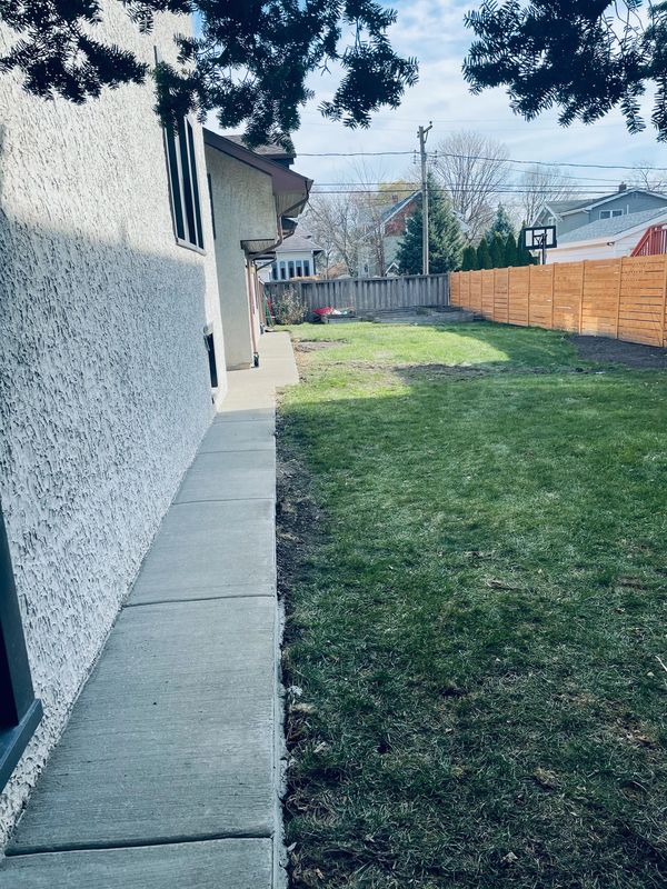 New Concrete walkway with drainage away from home.