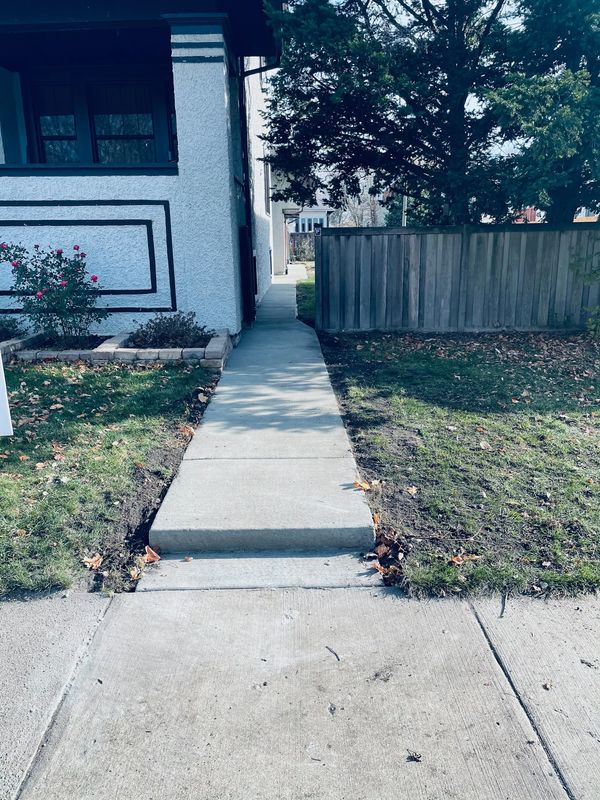 New Concrete walkway to backyard.