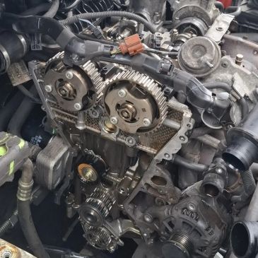 Close-up of an exposed car engine timing system.