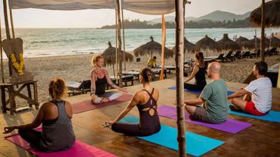 Peaceful daily yoga overlooking the beach